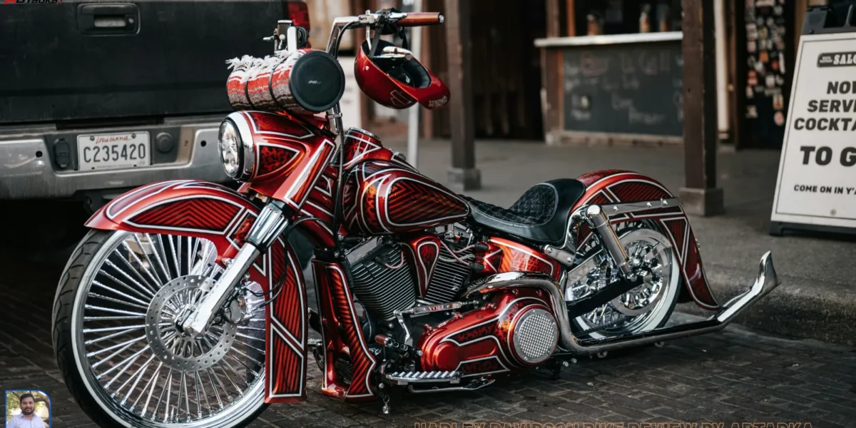 A high-resolution, real-life shot of a glossy Harley-Davidson CVO Road Glide ST parked in front of a modern Indian glass building, with the sun reflecting off the hand-painted chrome and forged carbon fiber details.