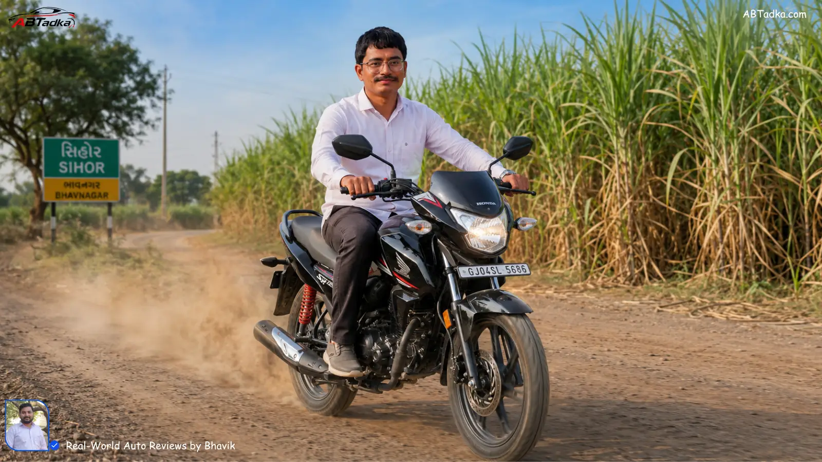 Bhavik Munjapara testing Honda SP 125 on dusty village road near Sihor, Bhavnagar with sugarcane fields in background