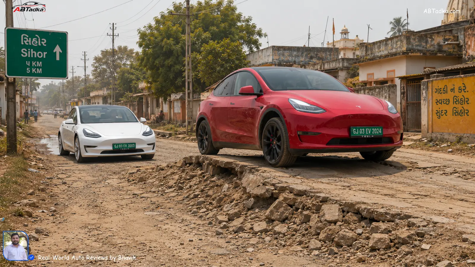 Tesla Model Y climbing a broken village road with high ground clearance while Model 3 sedan waits behind, showing real Indian road conditions